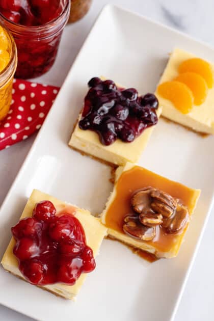 Slices of cheesecake with different cheesecake toppings.