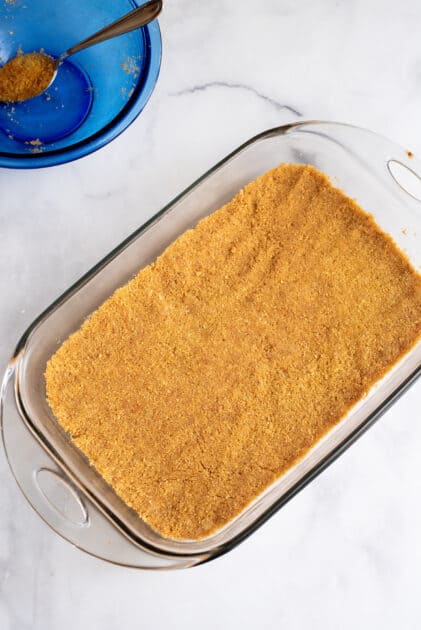 Press crust into the bottom of a baking dish.