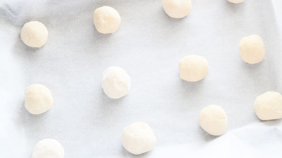 Place balls of dough on lined baking sheet.