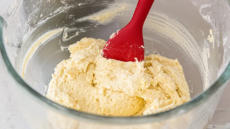 Slowly add rest of dry ingredients to cookie dough.