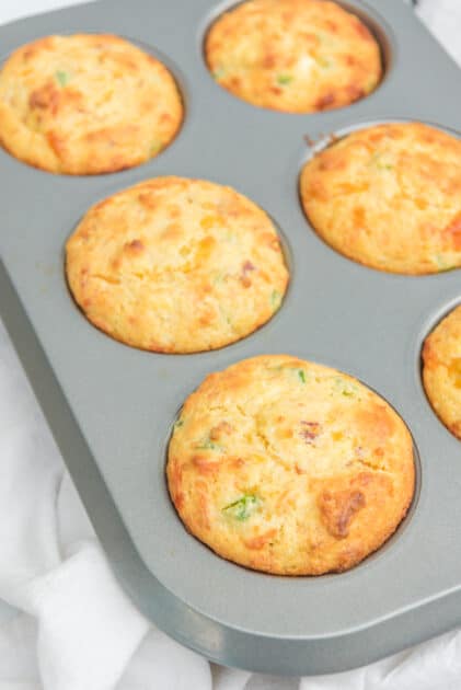 Golden brown Jalapeño cornbread muffins straight out of the oven.