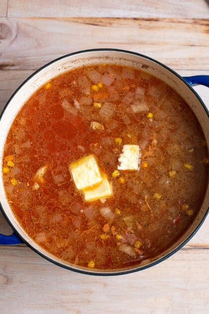 Butter melting in a pot of stew.