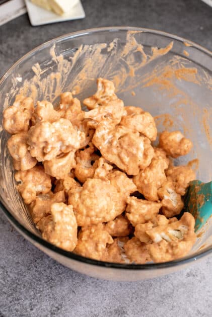 Add cauliflower florets to mixing bowl.