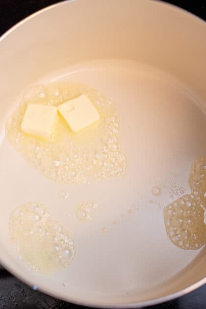 Melt butter in a large saucepan.