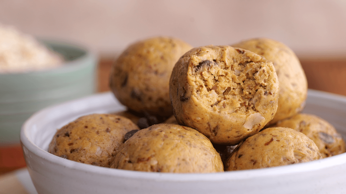 Bite taken out of a peanut butter protein ball.