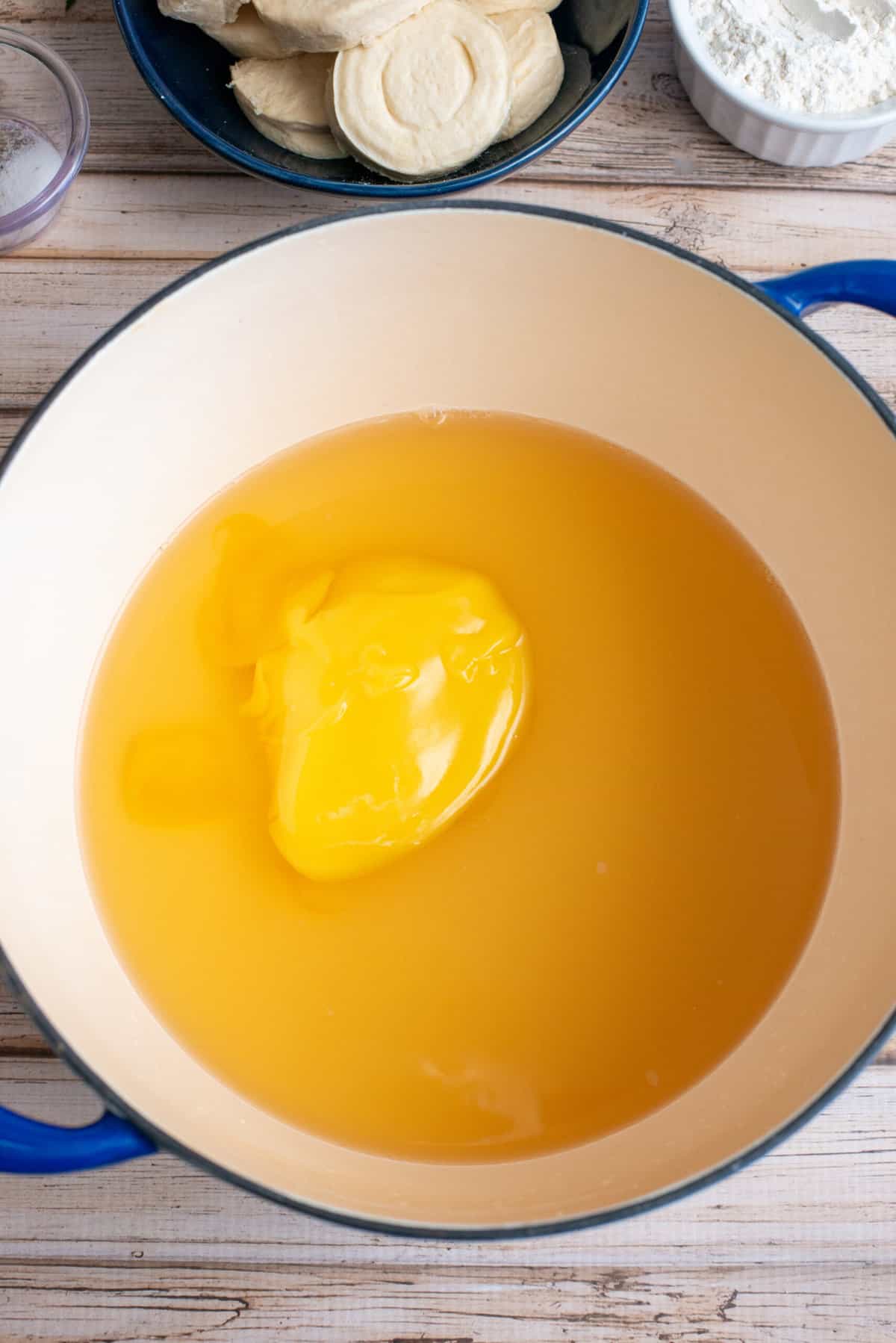 add cream of chicken soup to chicken broth