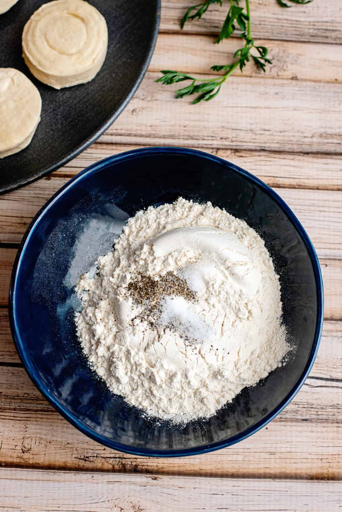 put flour and salt and pepper into a bowl