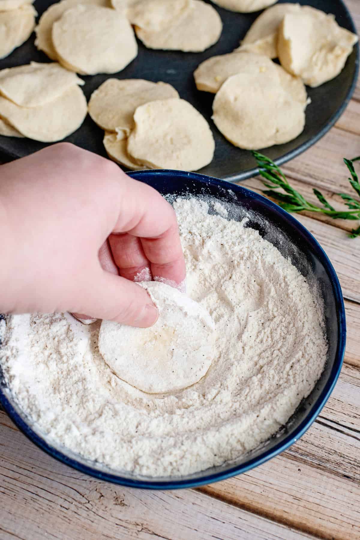 dip each biscuit layer in flour mixture