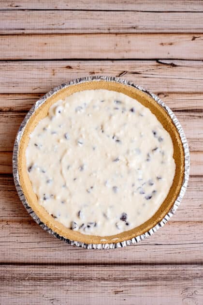 Pour cheesecake batter into pie crust.
