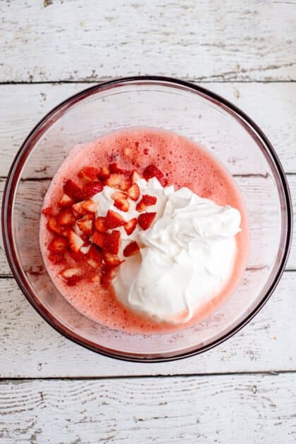 Add cool whip and sliced strawberries.