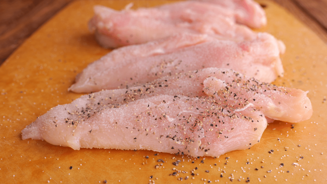 Salt and pepper both sides of the chicken breast.