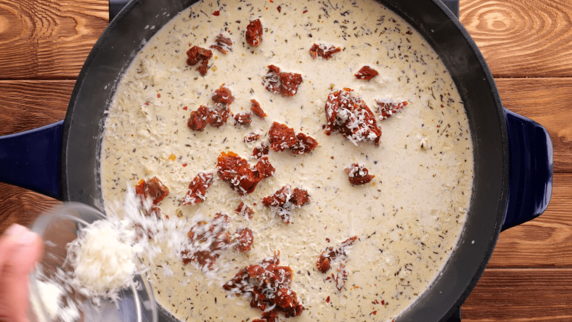 Add the sundried tomatoes and parmesan cheese to the skillet.