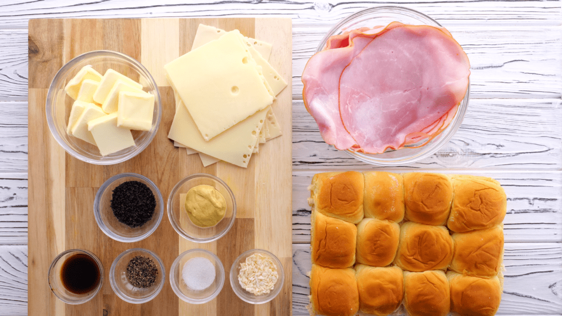 Recipe ingredients for ham and Swiss sliders.