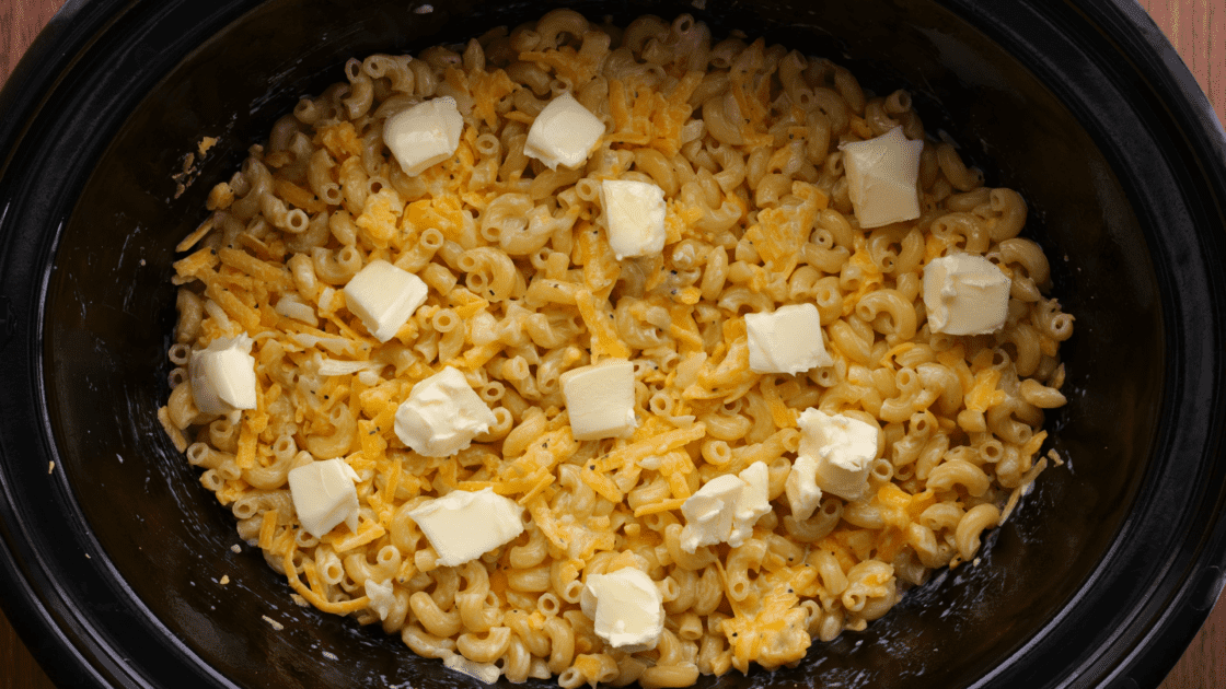 Add butter cubes to the top of the mac and cheese.