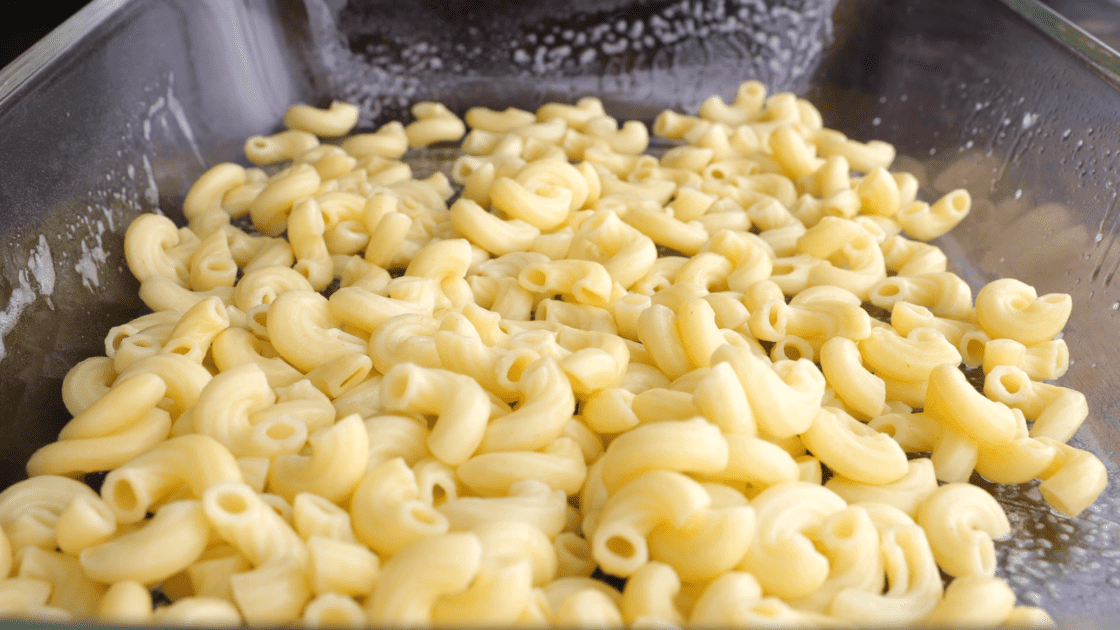 Place half of the macaroni in a casserole dish.