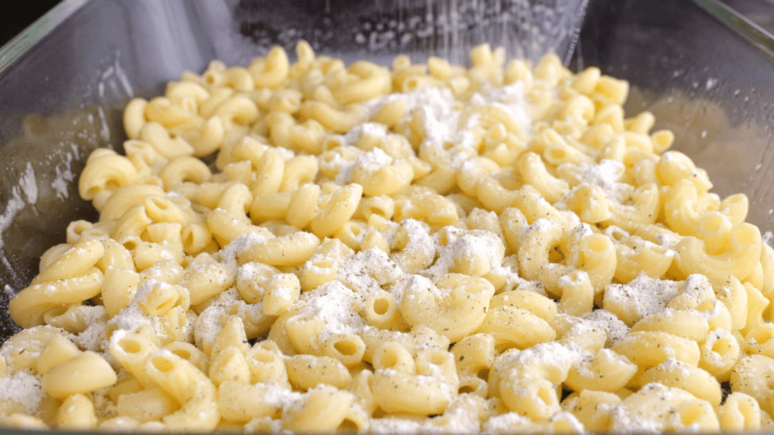 Sprinkle half of flour mixture over the pasta.