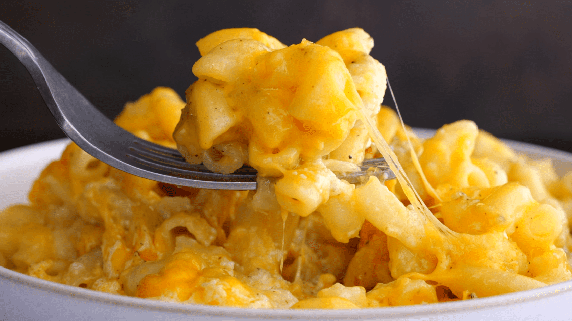 Close-up spoonful of baked mac and cheese.