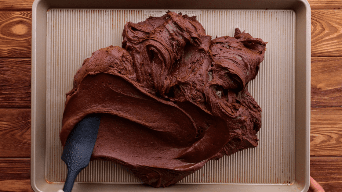 Spread brownie batter on baking sheet.