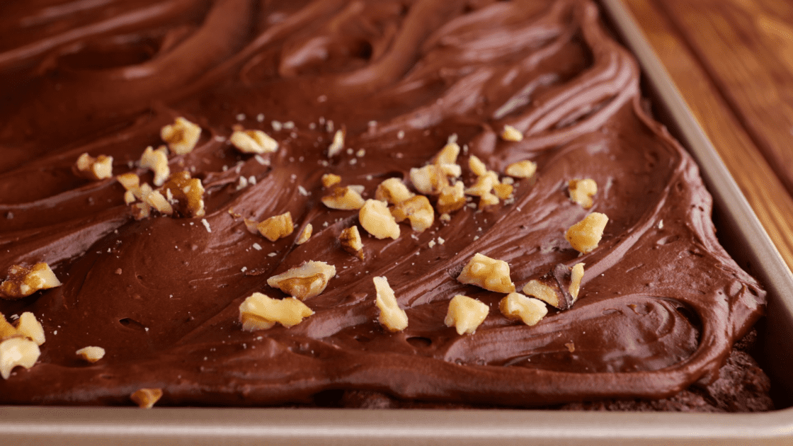 Sprinkle frosting with nuts if desired.