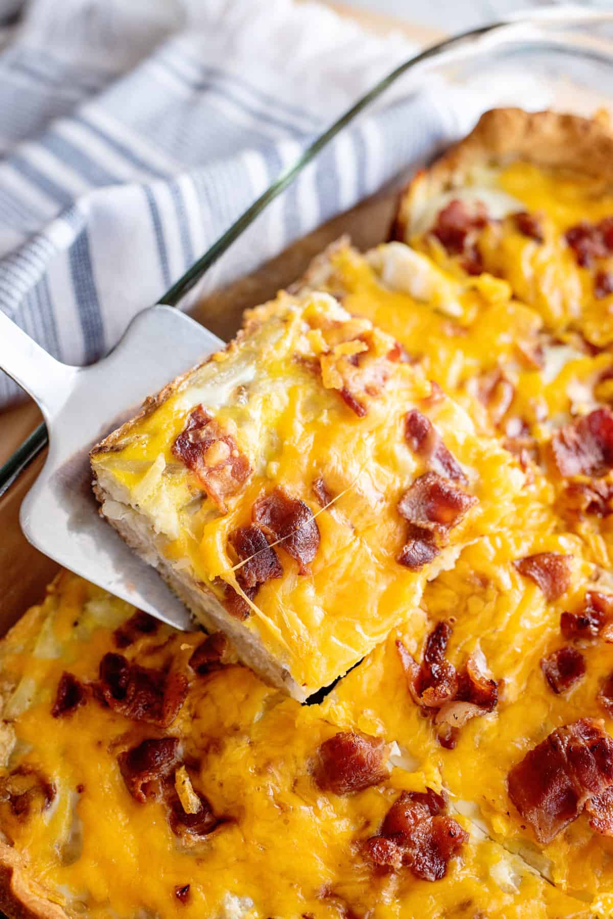 Slice of bacon breakfast casserole.