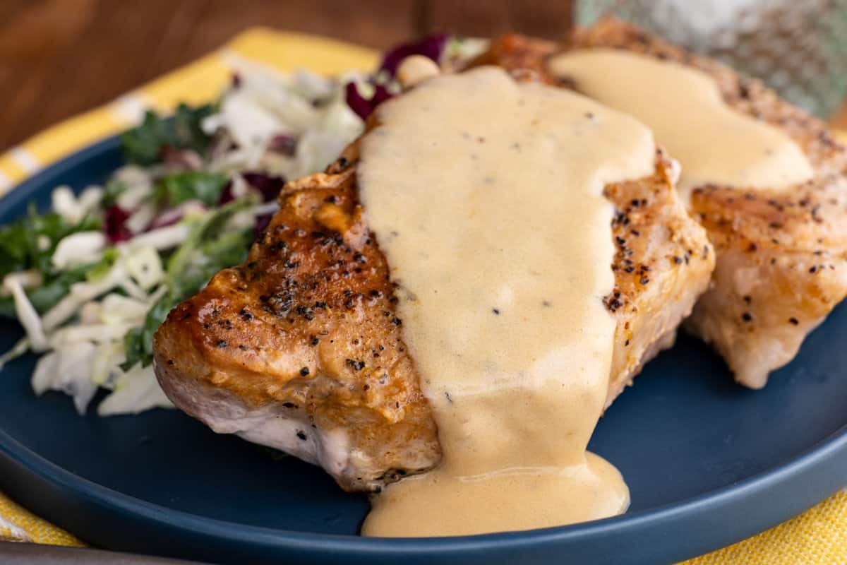 Pan-seared pork chops with cream sauce.