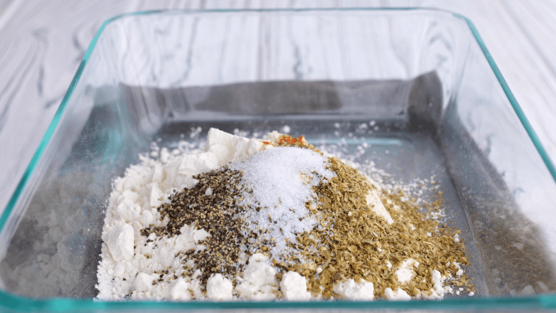Combine flour and seasonings in baking dish. Mix to combine.