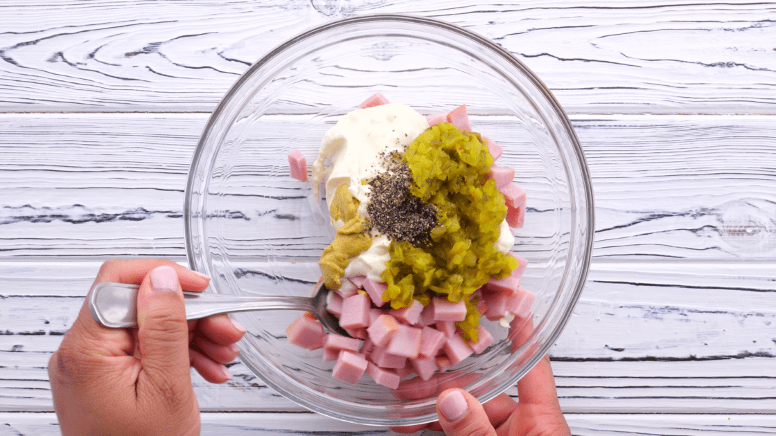 Stir ham salad ingredients together.