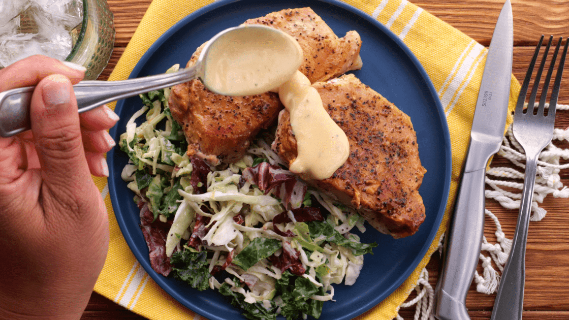 Top pork chops with cream sauce.