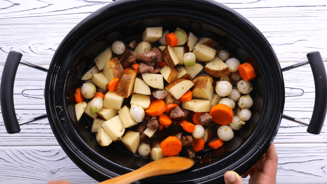 Stir beef stew ingredients together in crockpot.