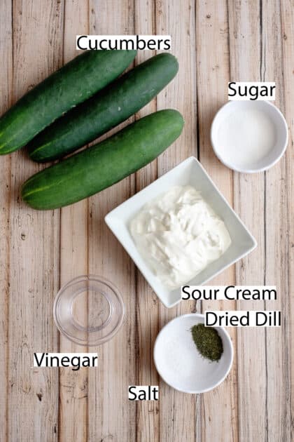 Labeled ingredients for creamy cucumber salad.
