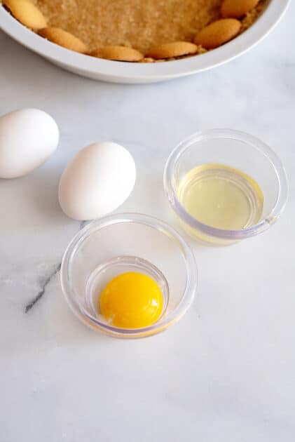 Place egg yolks in separate bowl to whites.
