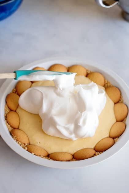 Spread meringue over the top of the lemon pie.