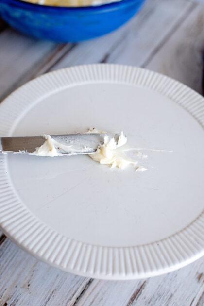 Add cream cheese icing to cake stand before icing the cake.