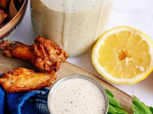 Alabama white barbecue sauce surrounded by ingredients.