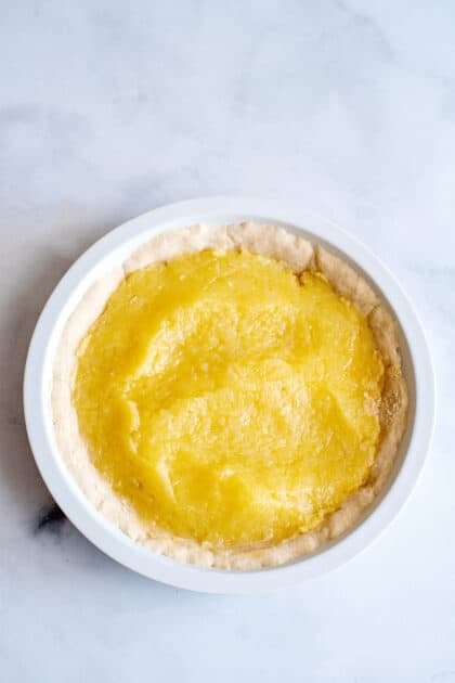 Add coconut pie filling to pie crust.