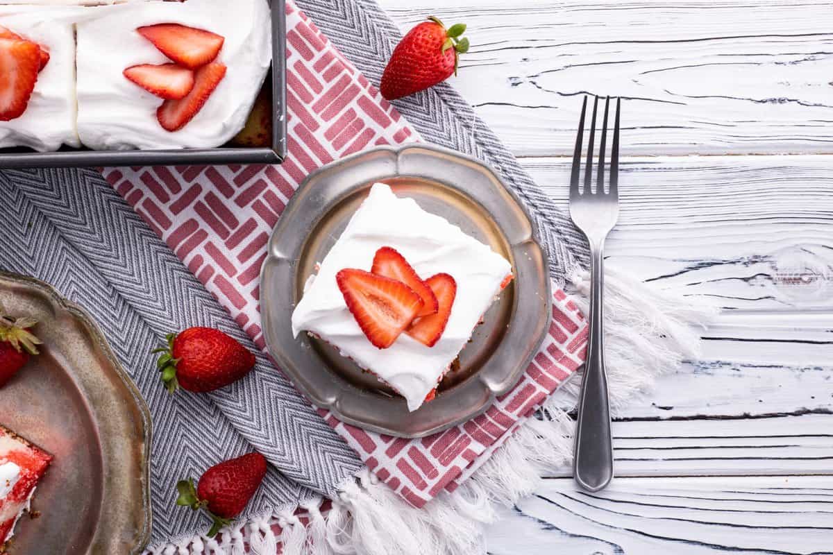 Slice of strawberry poke cake.