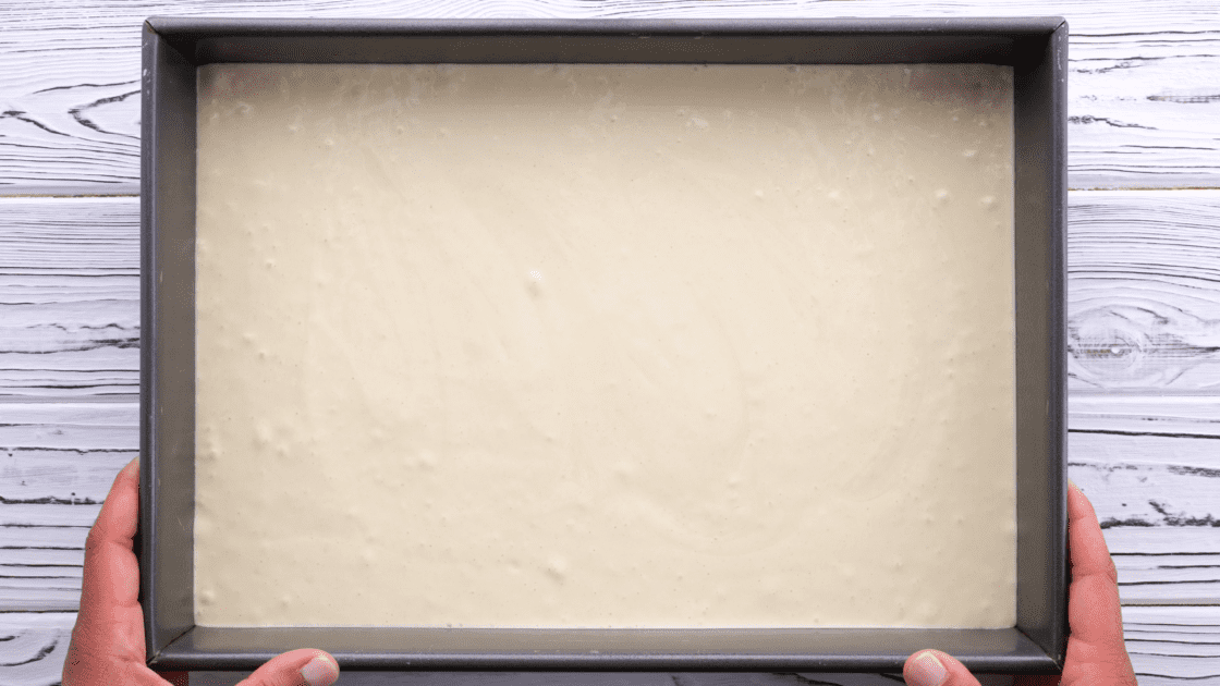 Spread cake batter into baking dish.