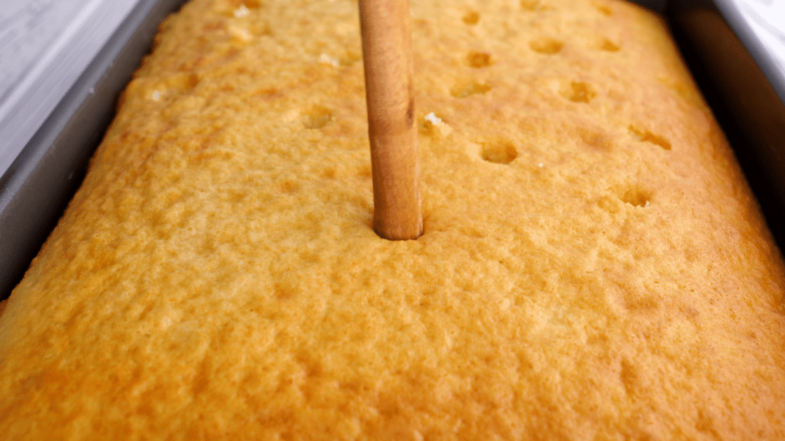 Poke holes with the end of a wooden spoon.