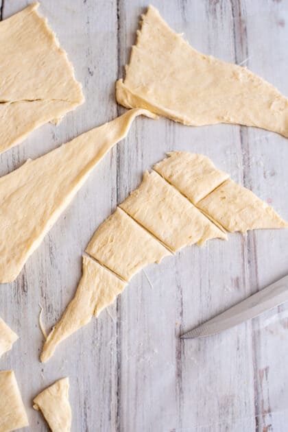 Cut each crescent roll triangle into fifths.
