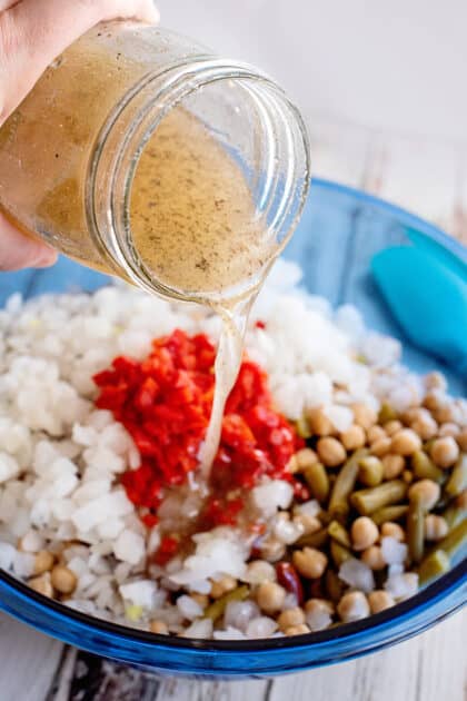 Pour dressing into mixing bowl.