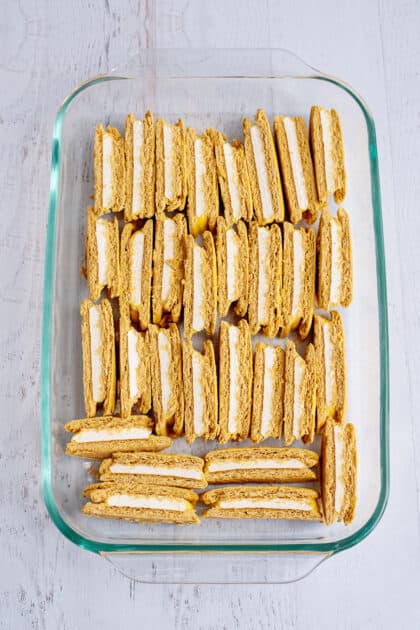 Arrange cut pies into baking dish.