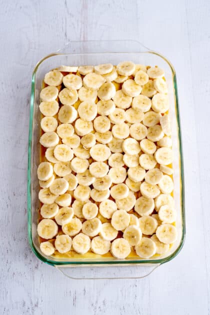 Place sliced bananas on top of caramel.