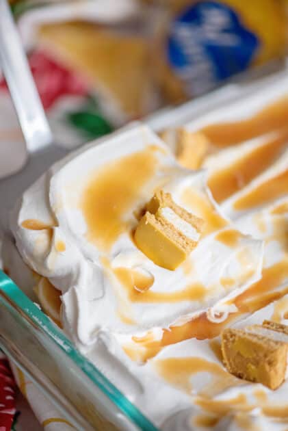 Removing slice of cake from baking dish.