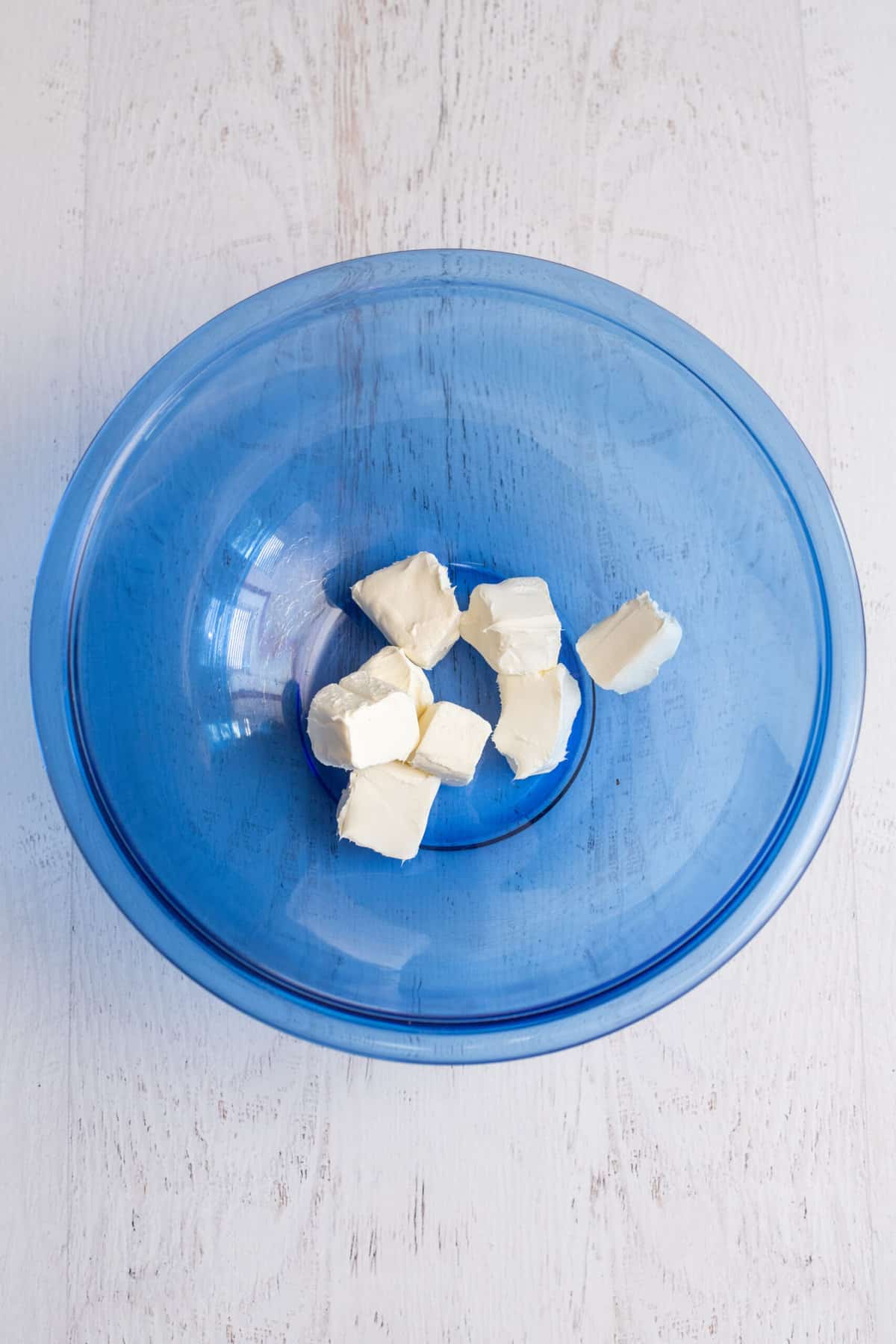 Place cubes of cream cheese in a large bowl.