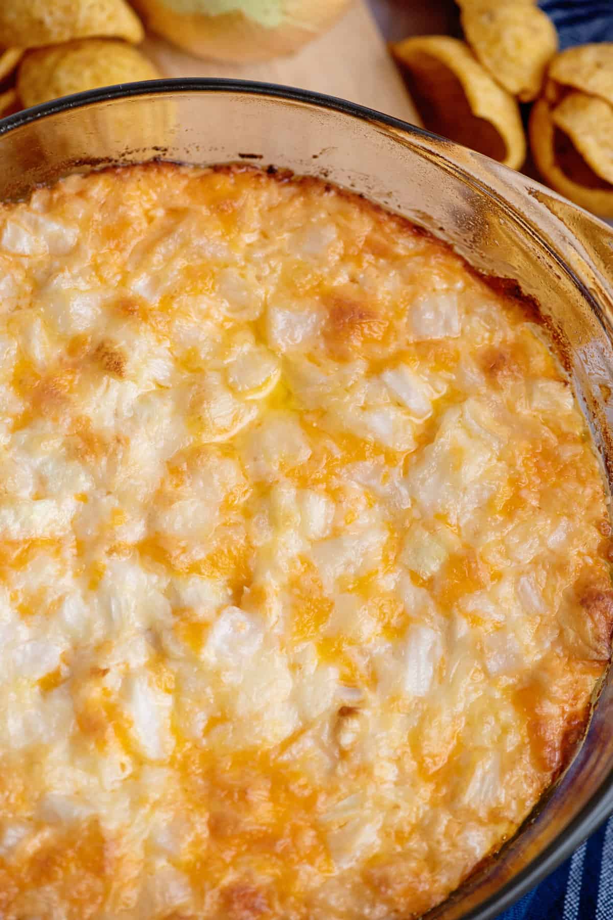 Close-up of cheesy baked onion dip.