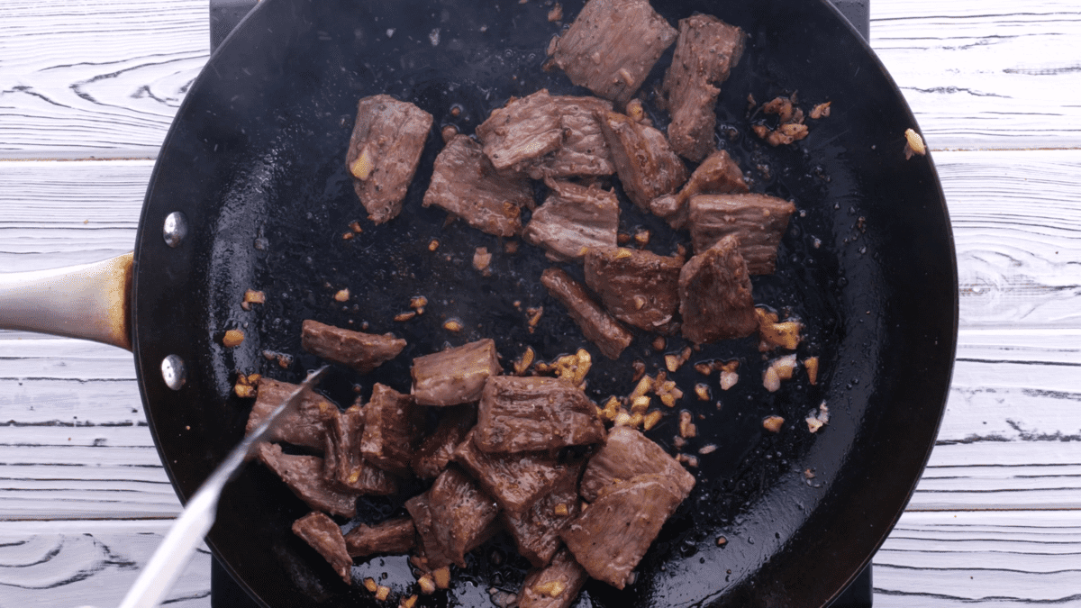 Cook steak until no longer pink.