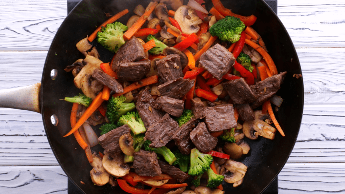 Return steak to skillet.