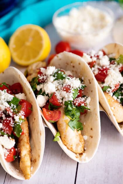 Stack of Greek chicken tacos.