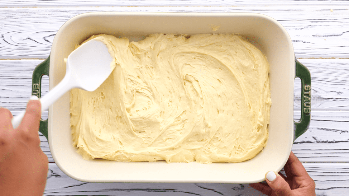 Pour cake batter into prepared pan.