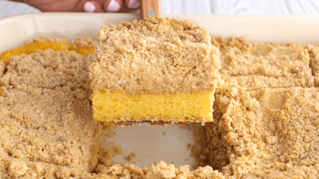 Slice of crumb cake on a spatula.